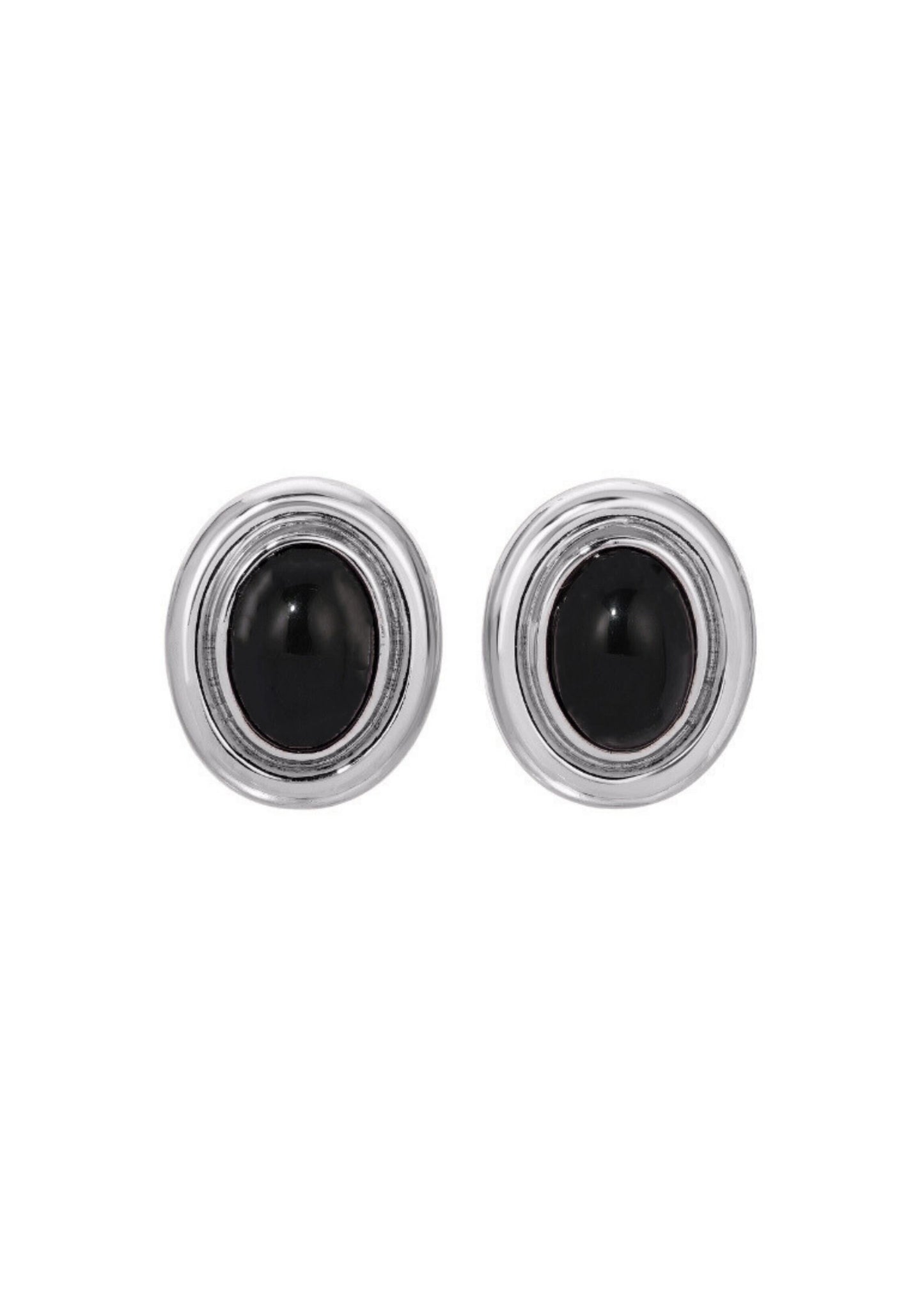Pair of silver earrings with black gemstones on a white background