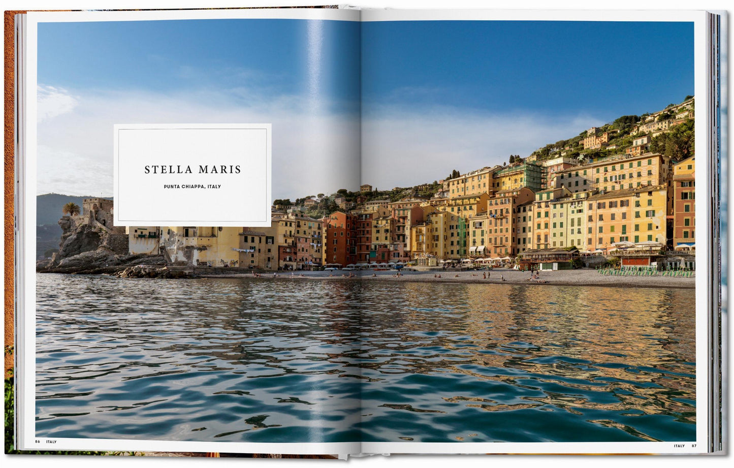 Open book showing a scenic view of a coastal town with 'Stella Maris' branding.