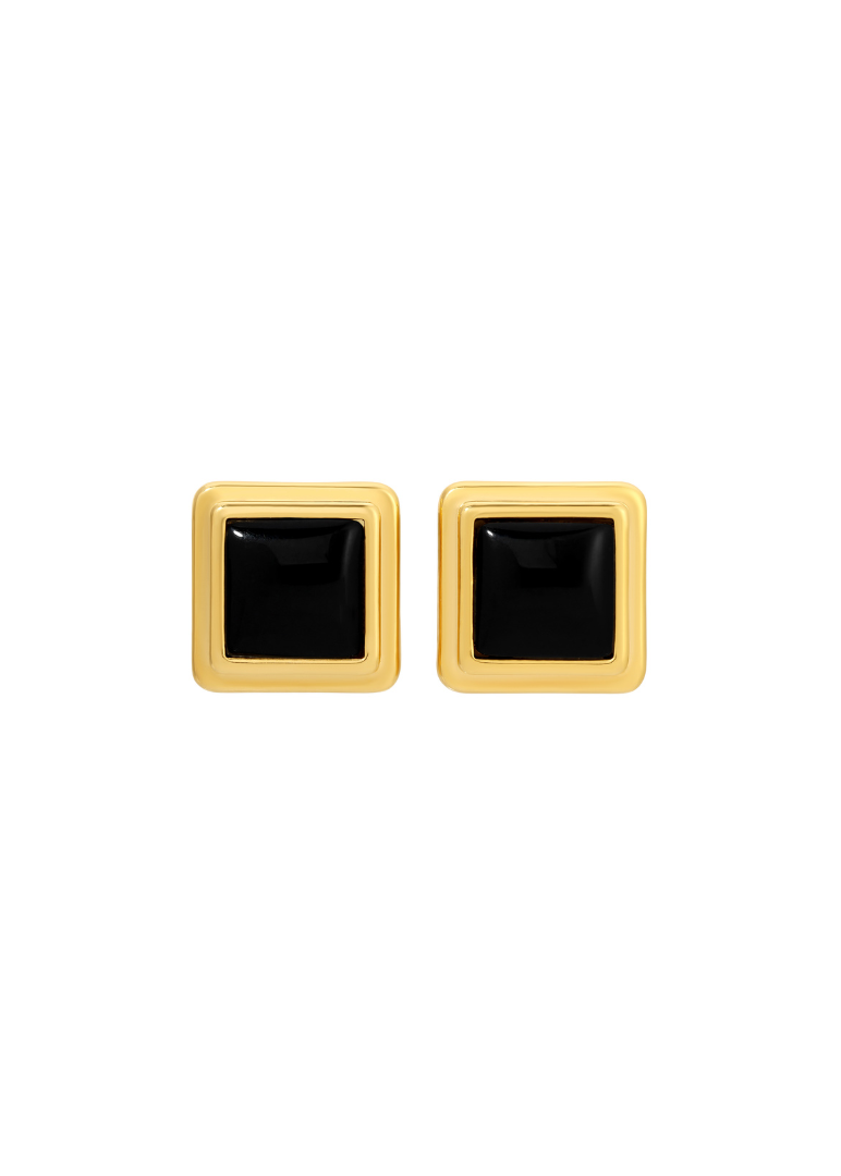 Pair of square-shaped earrings with black centers and gold frames on a white background