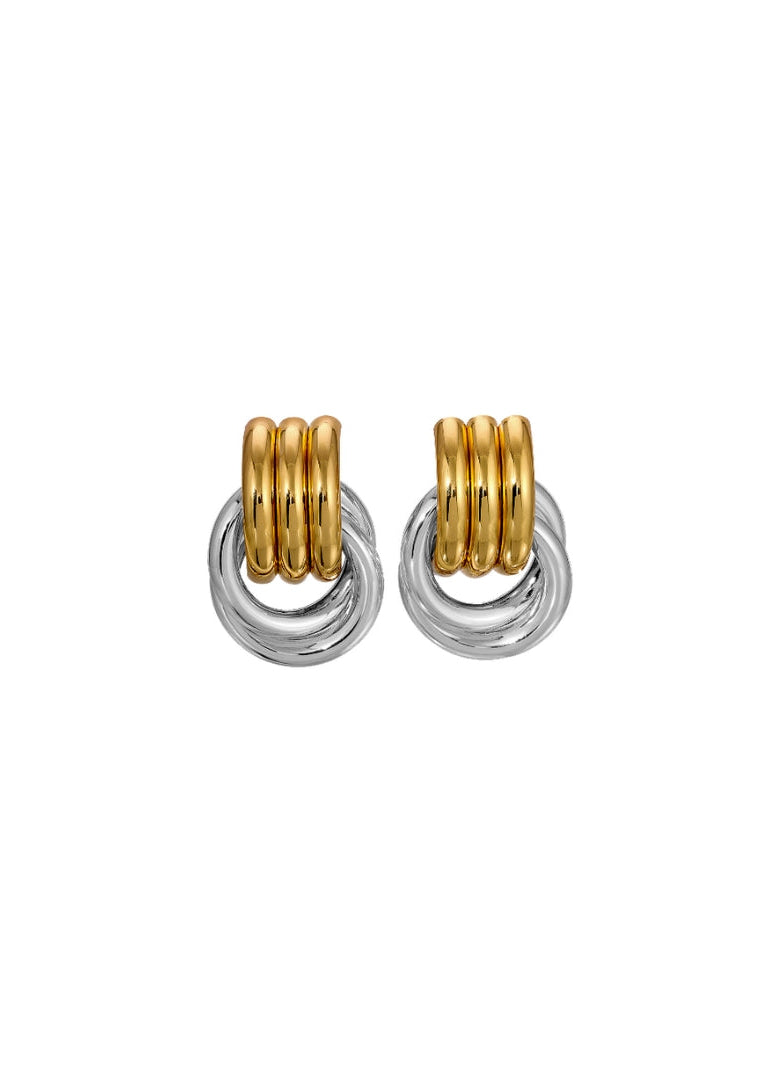 Pair of gold and silver hoop earrings on a white background