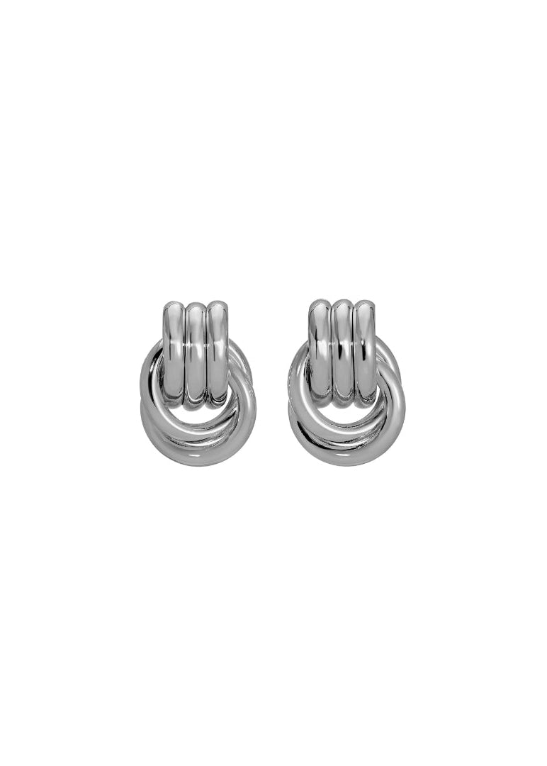Pair of silver knot earrings on a white background