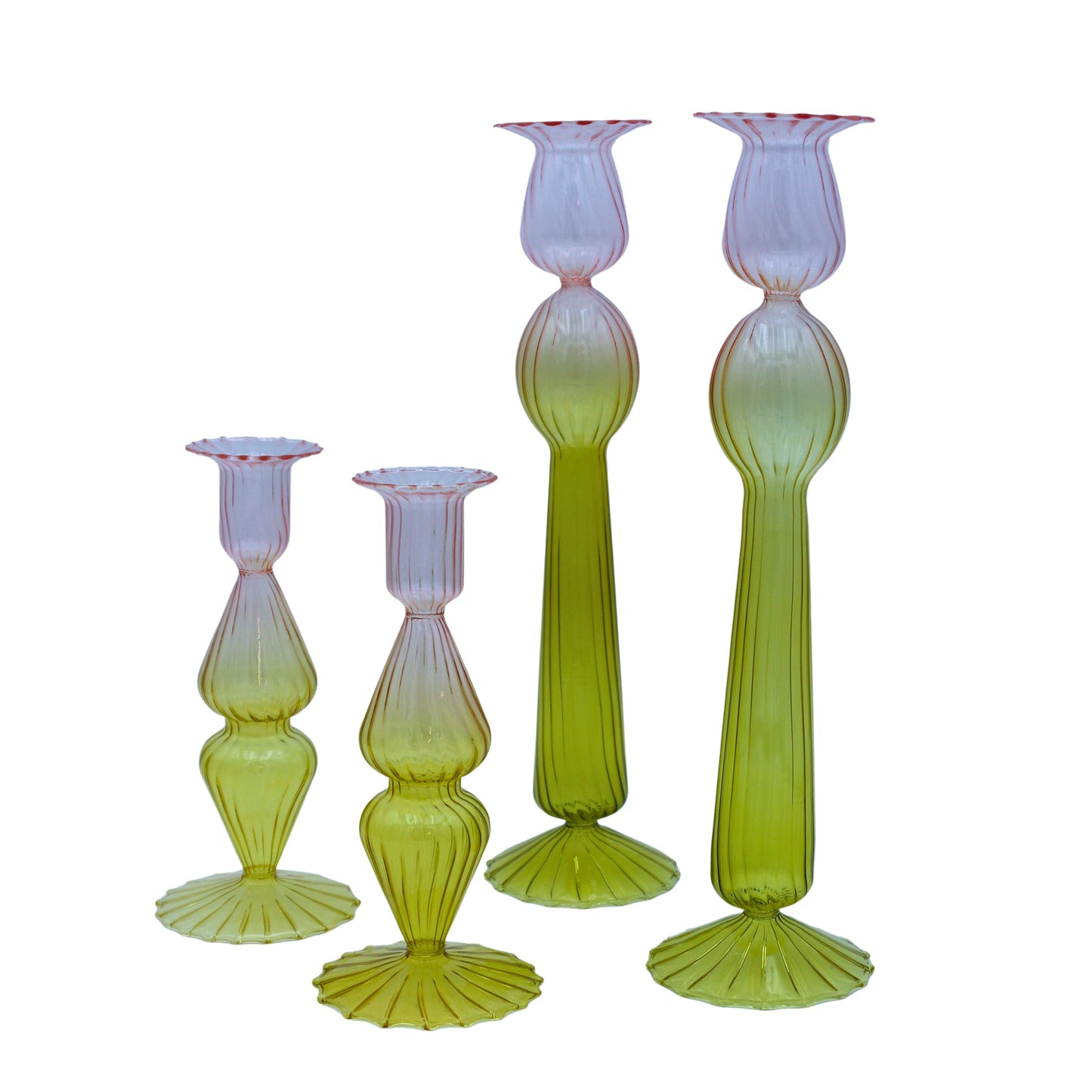 Set of five green glass candle holders on a white background