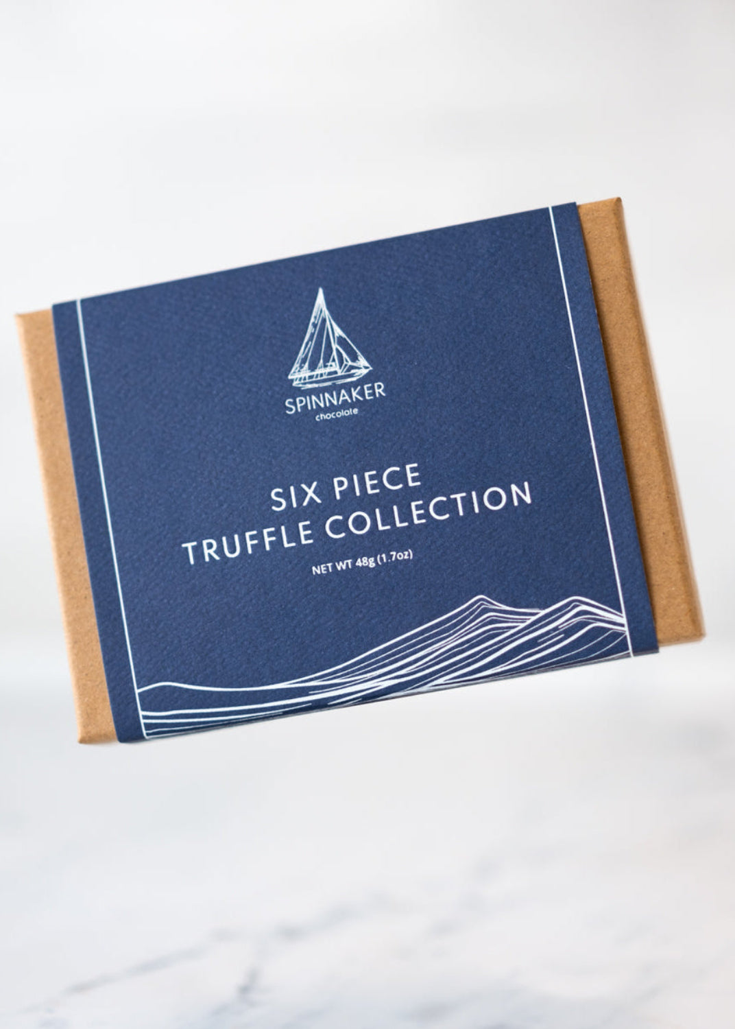 Box of Spinnaker Truffles on a marble surface