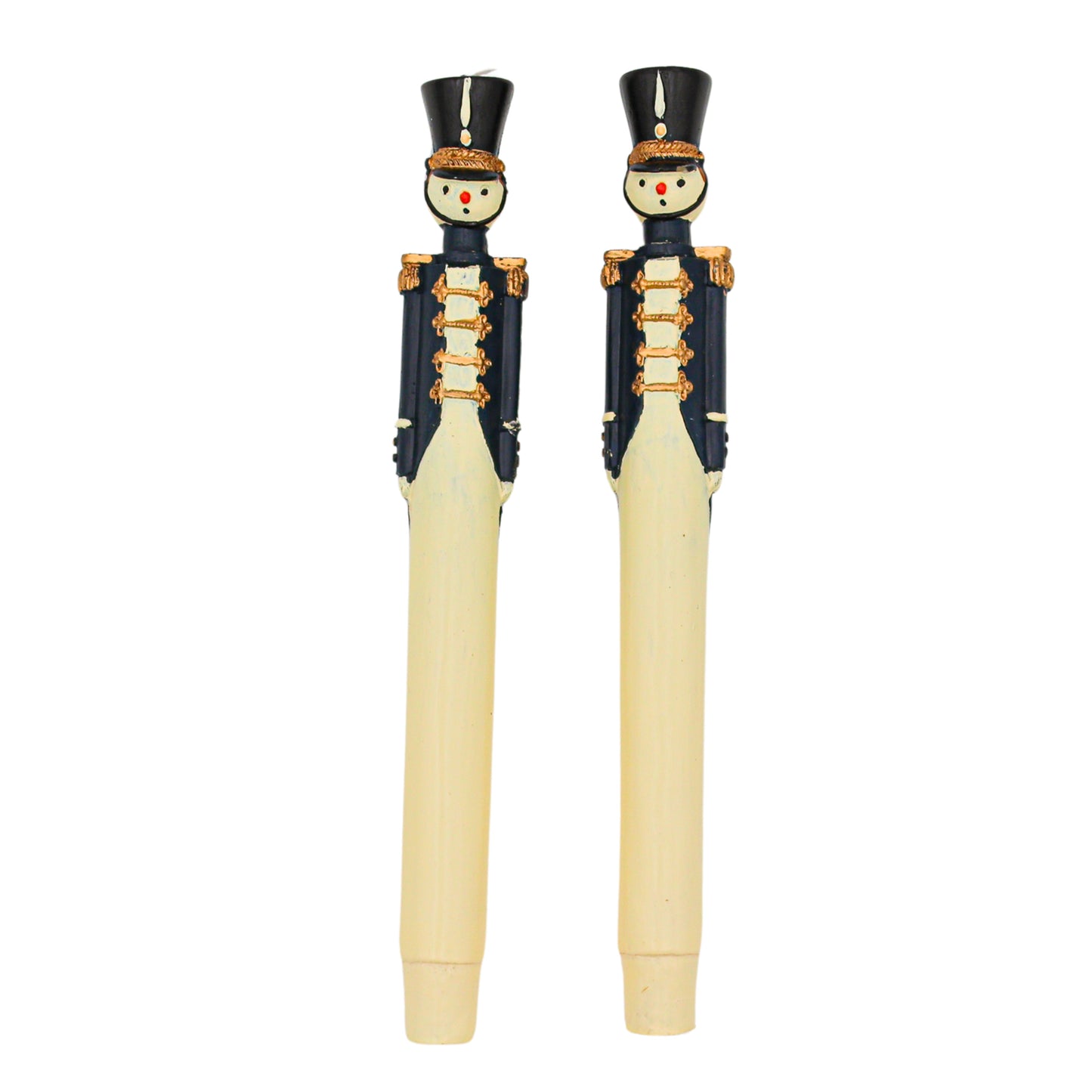 Two pilar candles shaped like toy soldiers on a white background