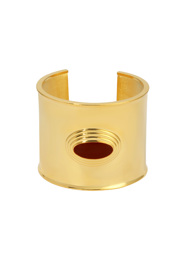 Gold cuff bracelet on a white background