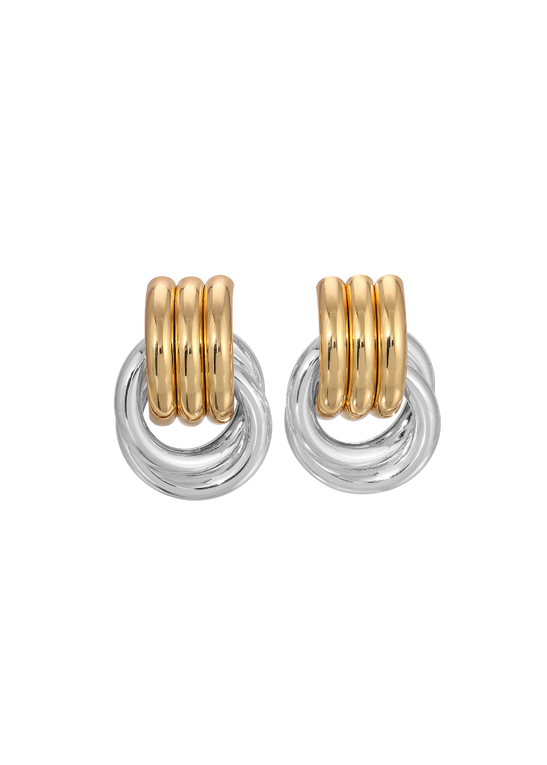 Pair of gold and silver hoop earrings on a white background