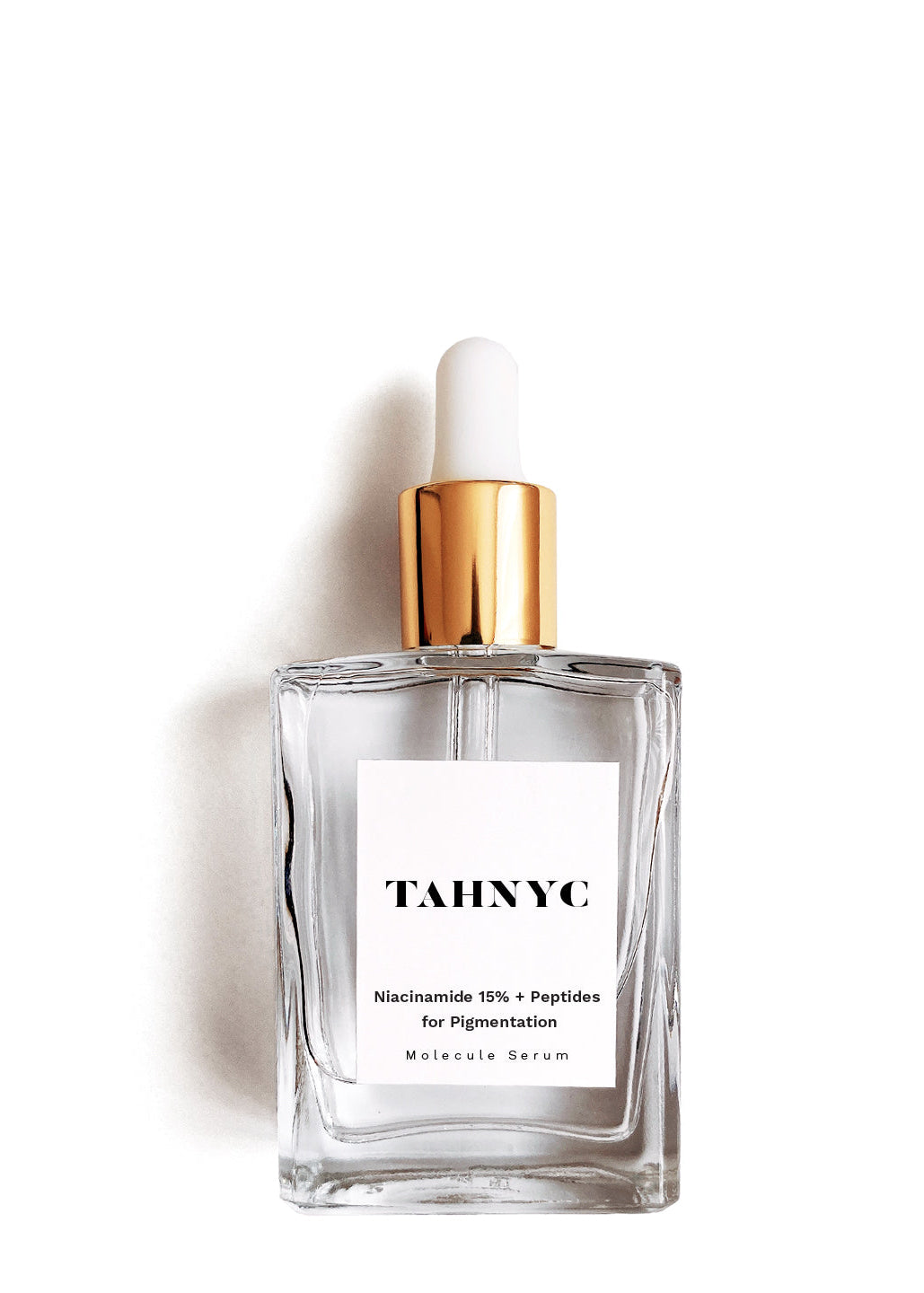 Tahnc skincare serum bottle with dropper on a white background