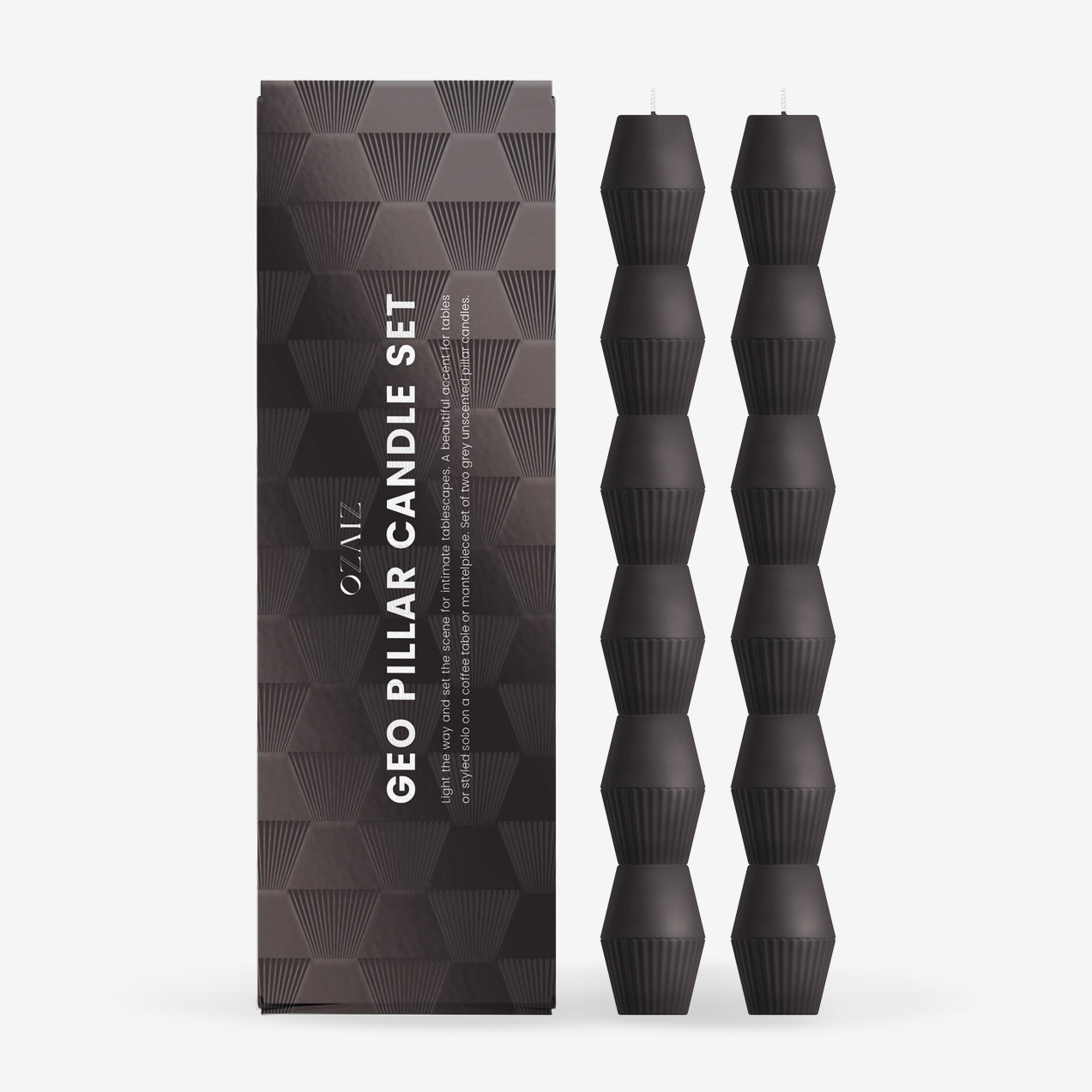 Black geometric pillar candles with packaging on a white background