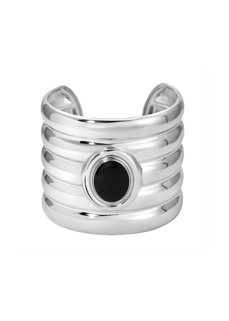 Silver cuff bracelet with a black gemstone on a white background