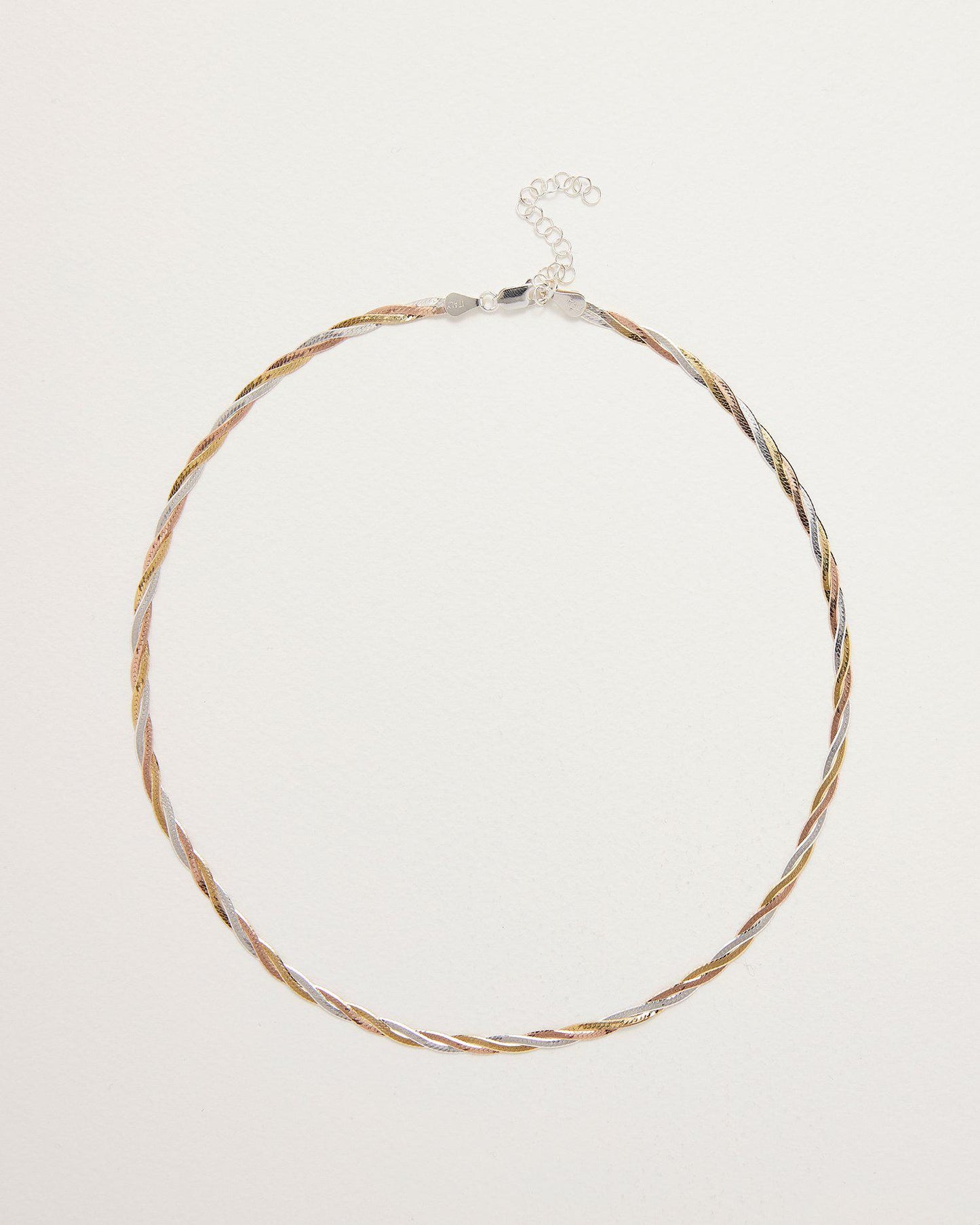 Necklace with braided design on a light gray background
