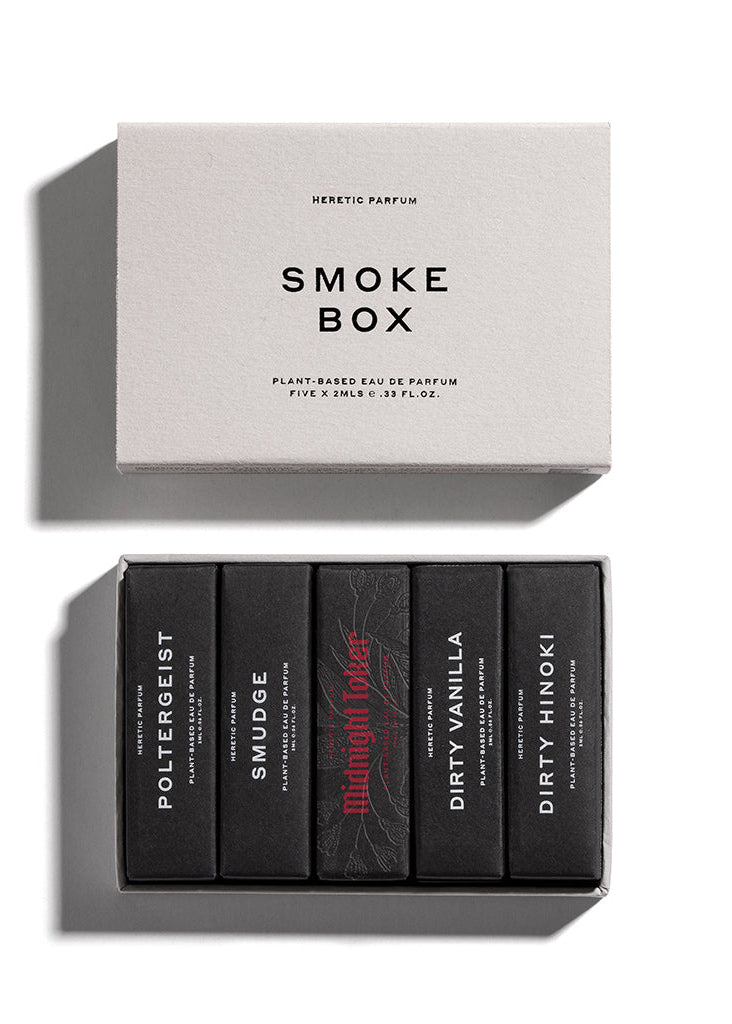 Collection of HERETIC PARFUM perfume bottles in a 'Smoke Box' packaging on a white background