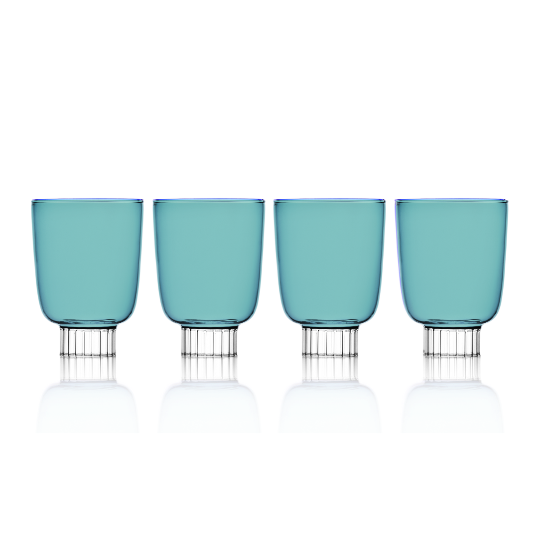 Set of four blue glasses with clear bases on a white background
