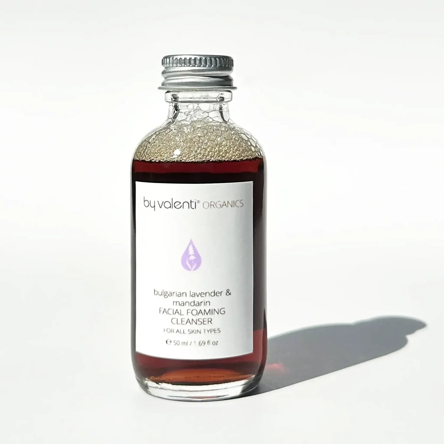 Bottle of Bulgarian Lavender & Mandarin Facial Foaming Cleanser by Valenti Organics on a white background