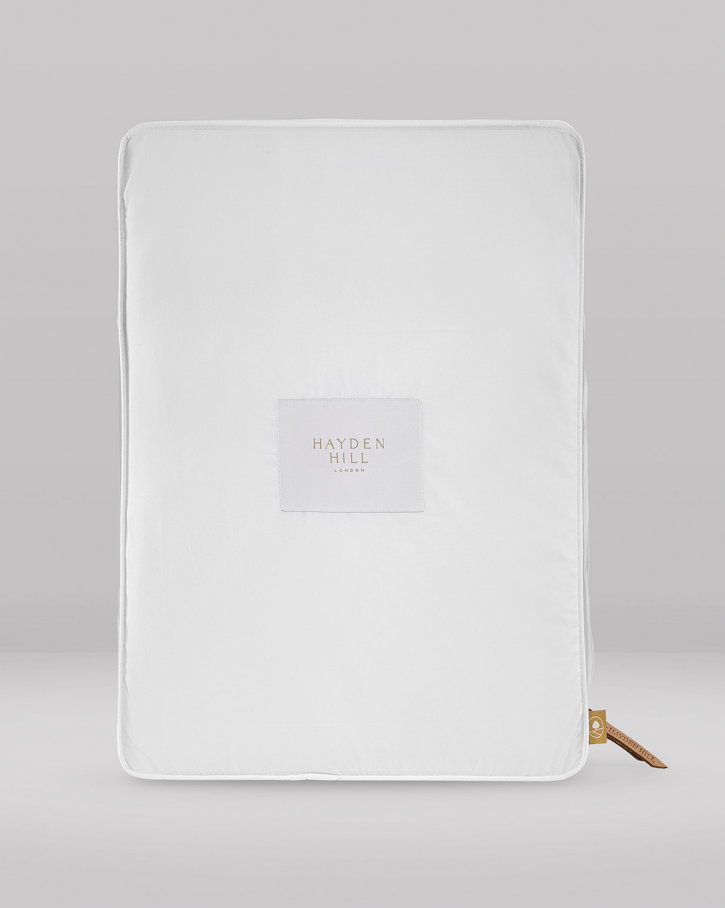 White organic cotton storage cube with Hayden Hill company logo 