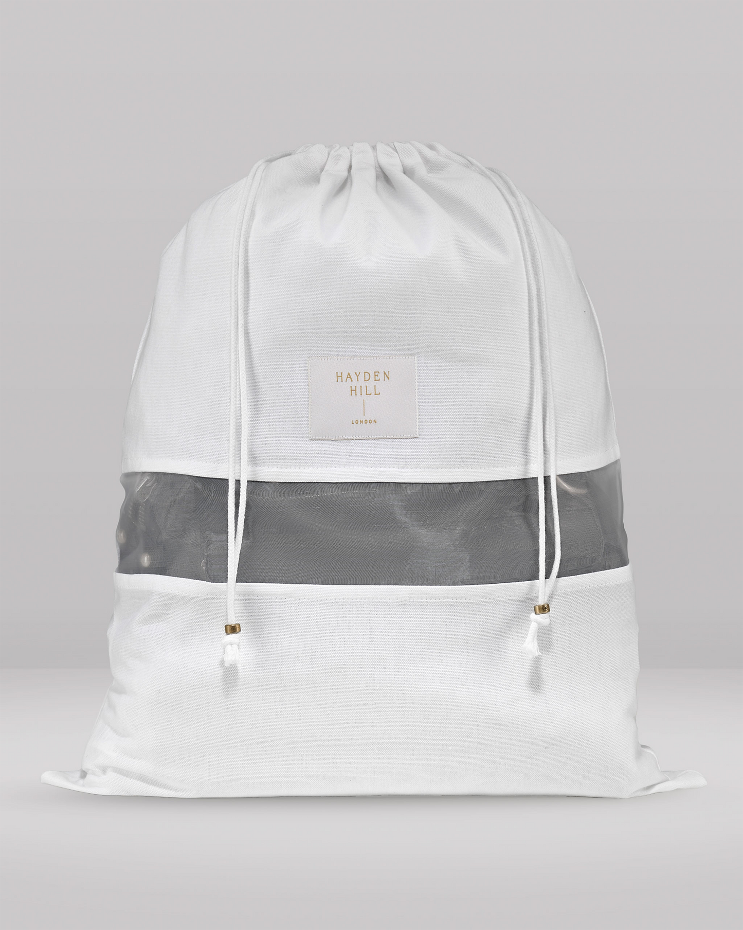 White drawstring bag with gray stripe on a light gray background