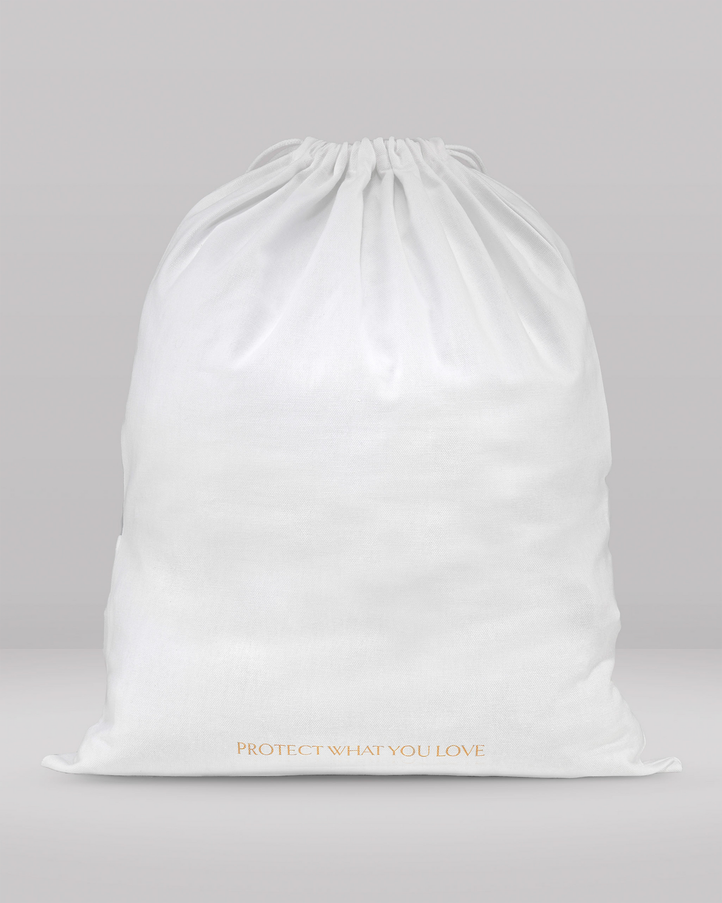 White drawstring bag with 'PROTECT WHAT YOU LOVE' text on a gray background