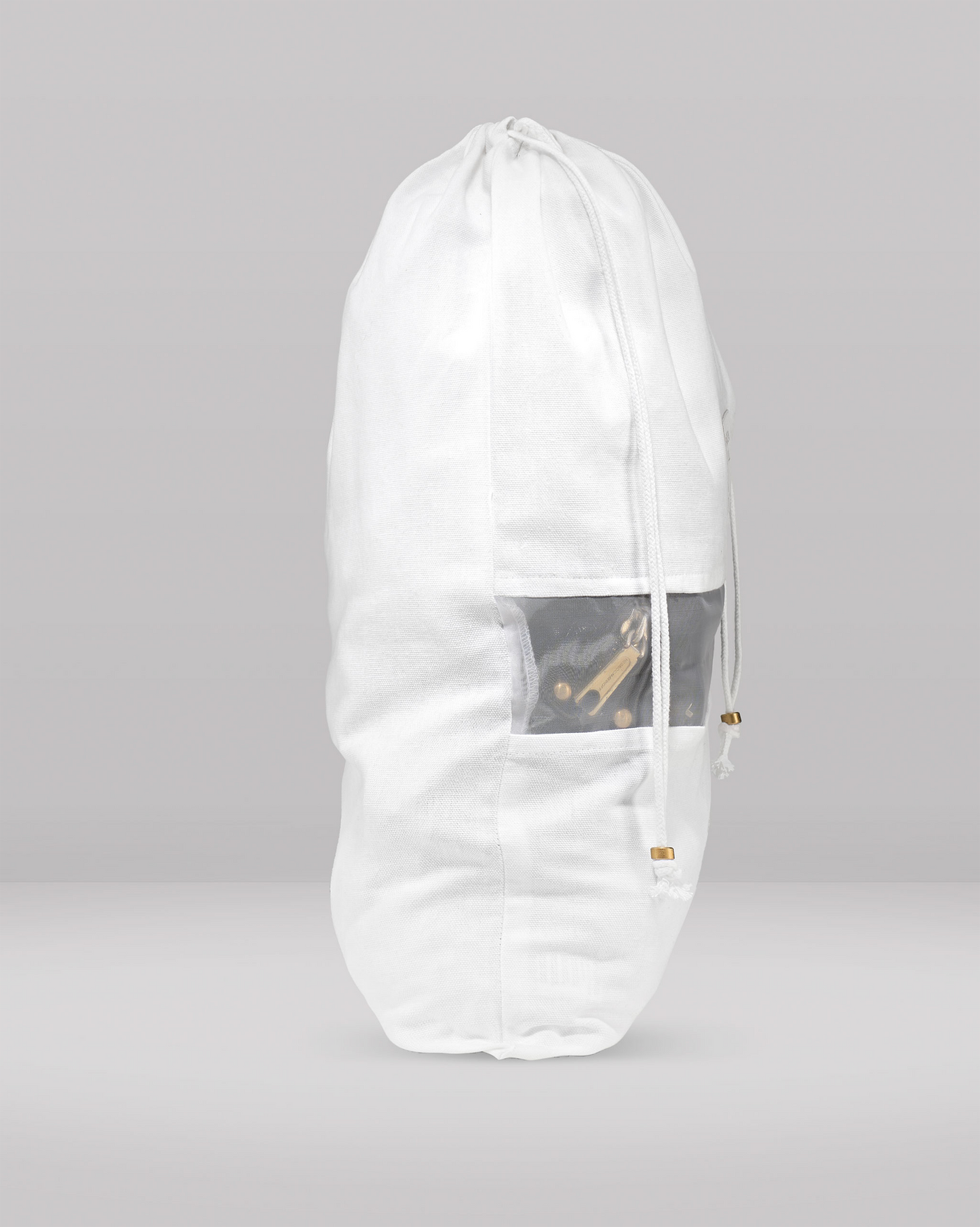 White garment bag with a clear window on a gray background