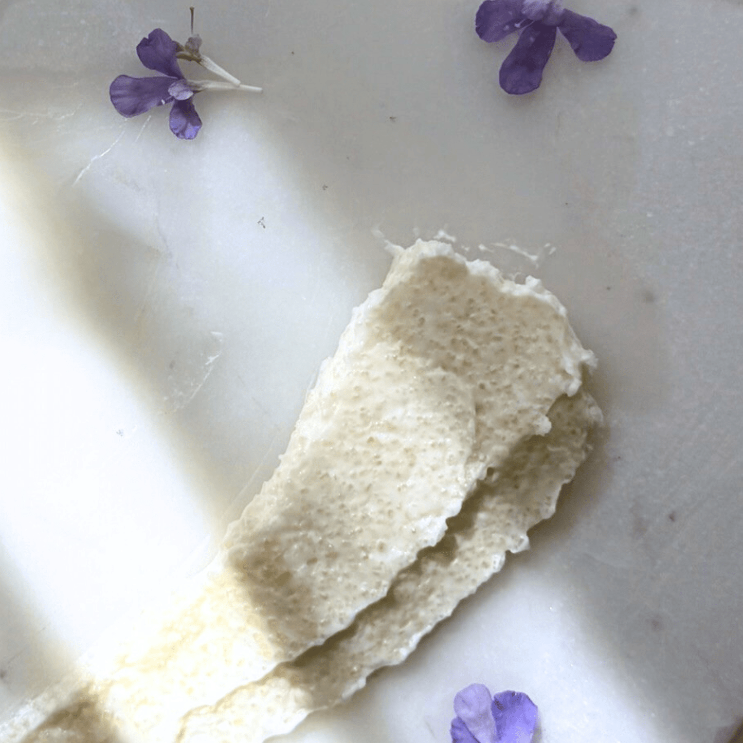 Sugar Scrub texutre reference on a marble surface. 