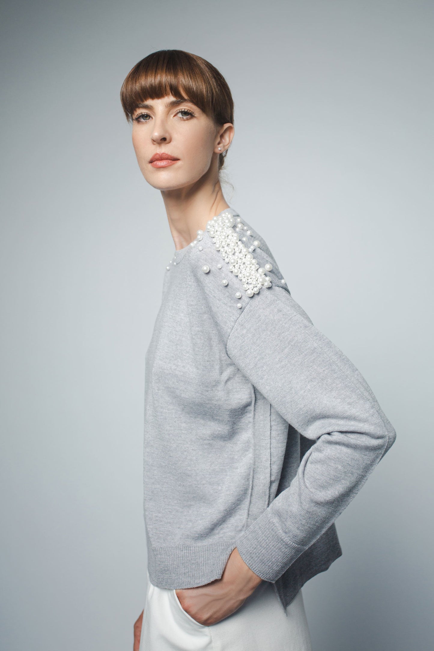 
                  
                    KATHRYN RELAXED FIT PULLOVER WITH PEARL BEADING IN HEATHER GREY
                  
                