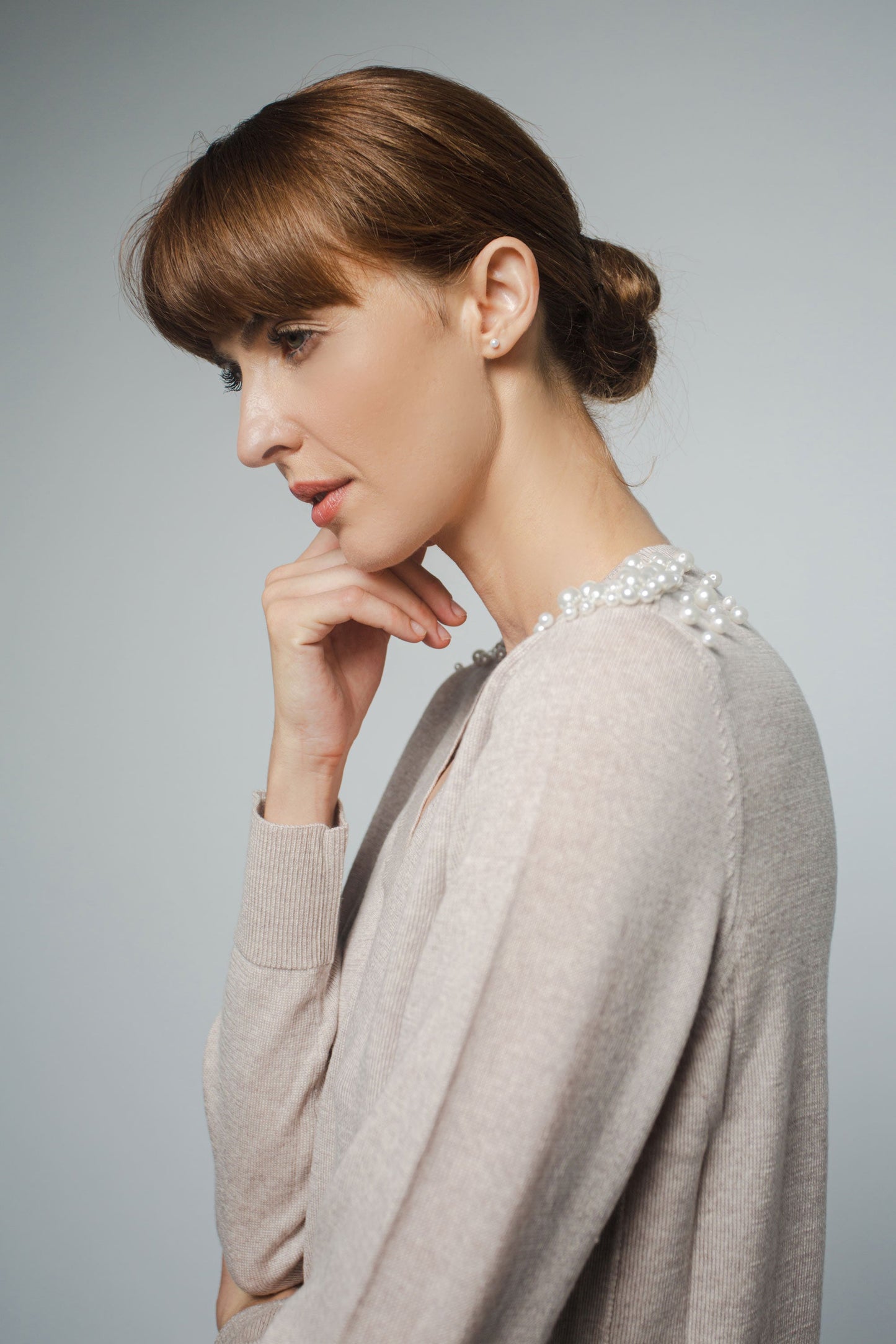 
                  
                    JULIA V-NECK PULLOVER WITH PEARL BEADING IN MARCONA
                  
                