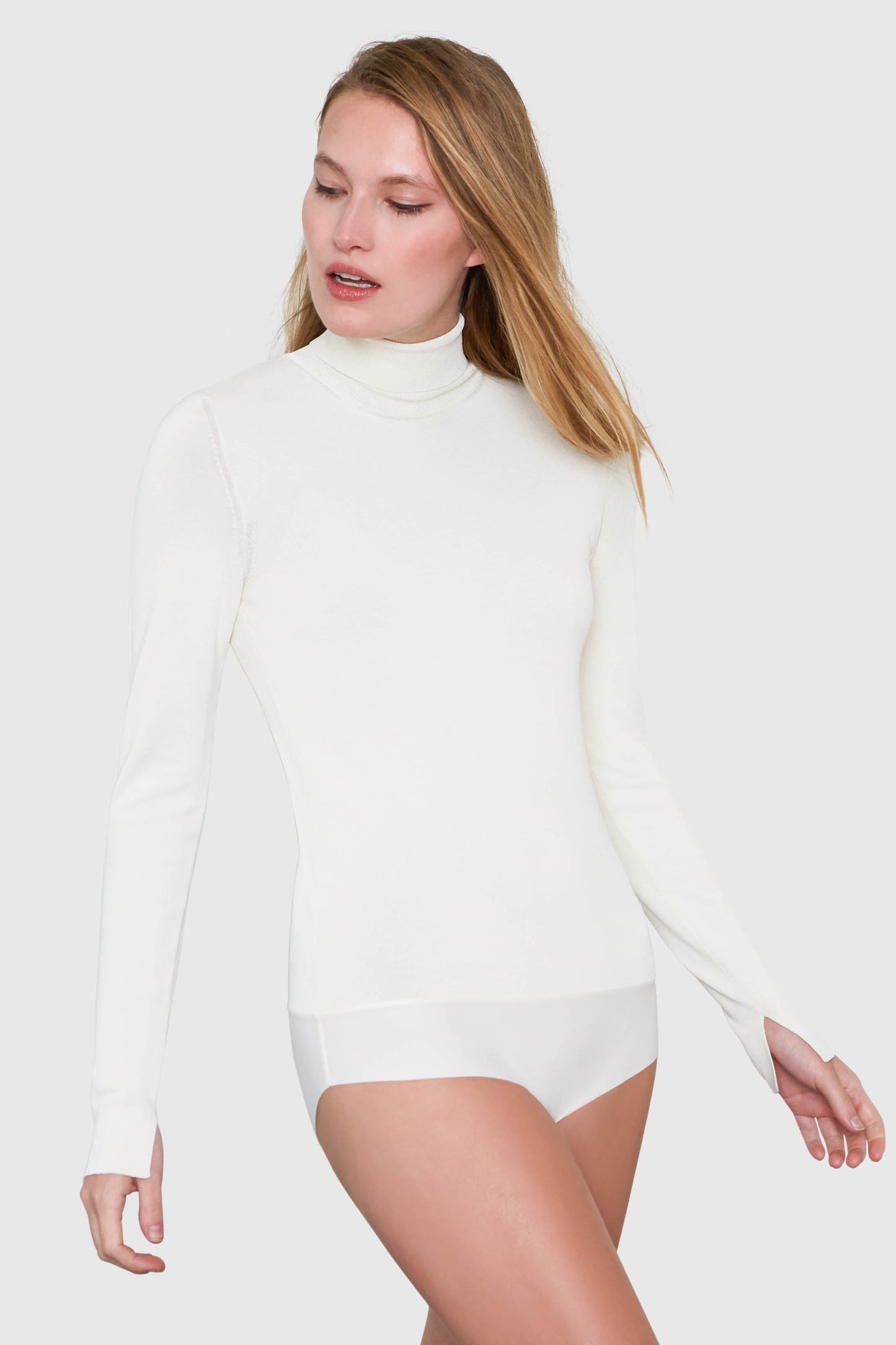 Long sleeve turtleneck bodysuit in white made from Italian yarn. – Santicler