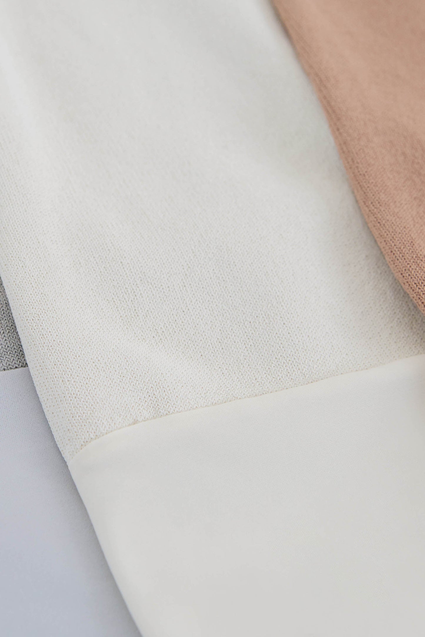 Long sleeve turtleneck bodysuit in white made from Italian yarn. – Santicler